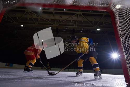 Image of teen ice hockey sport  players in action