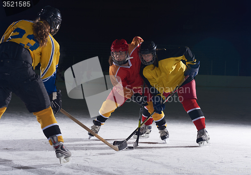 Image of teen ice hockey sport  players in action