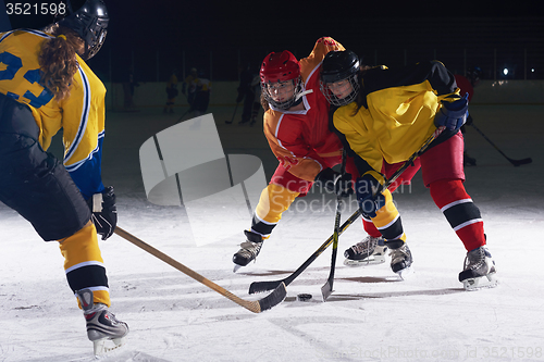 Image of teen ice hockey sport  players in action