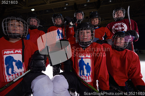 Image of happy children gropu  hockey team sport players