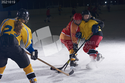 Image of teen ice hockey sport  players in action