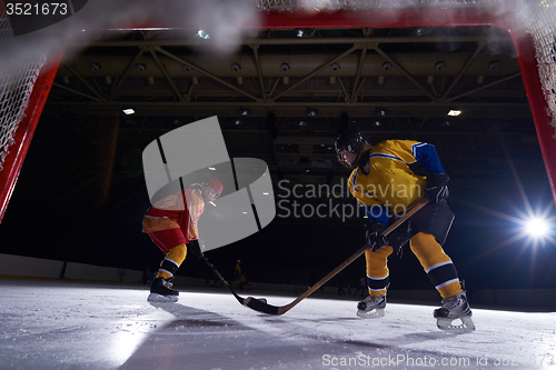 Image of teen ice hockey sport  players in action