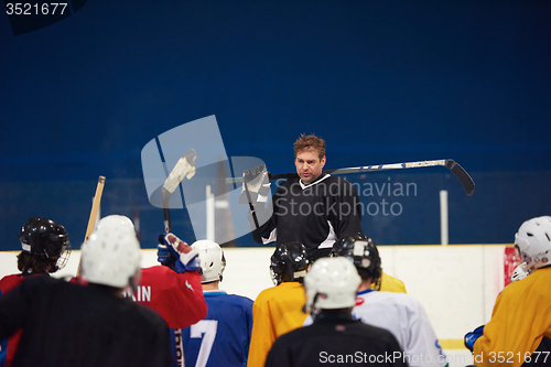 Image of ice hockey players team meeting with trainer