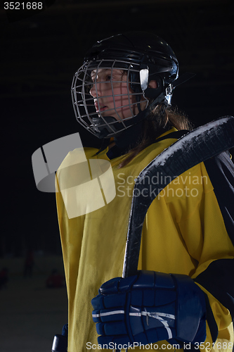 Image of teen girl  ice hockey player portrait