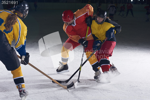 Image of teen ice hockey sport  players in action
