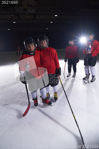 Image of happy children gropu  hockey team sport players