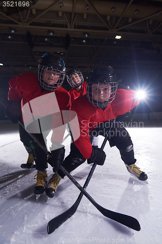 Image of happy children gropu  hockey team sport players