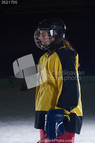 Image of teen girl  ice hockey player portrait