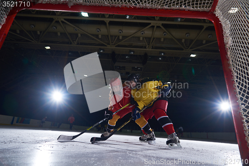 Image of teen ice hockey sport  players in action