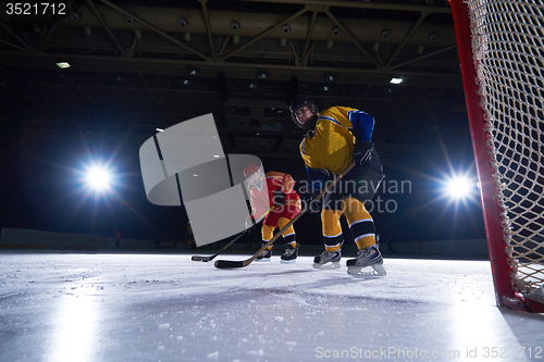 Image of teen ice hockey sport  players in action