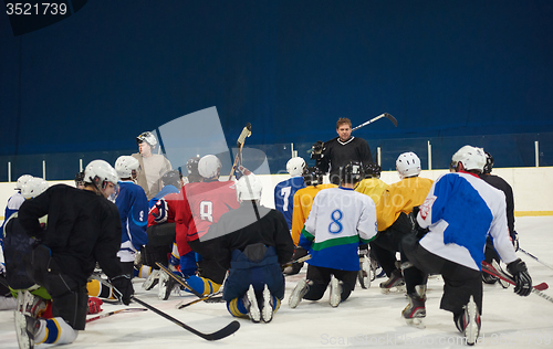 Image of ice hockey players team meeting with trainer