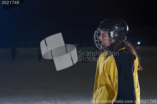 Image of teen girl  ice hockey player portrait