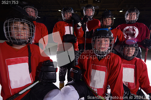 Image of happy children gropu  hockey team sport players