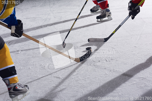 Image of teen ice hockey sport  players in action