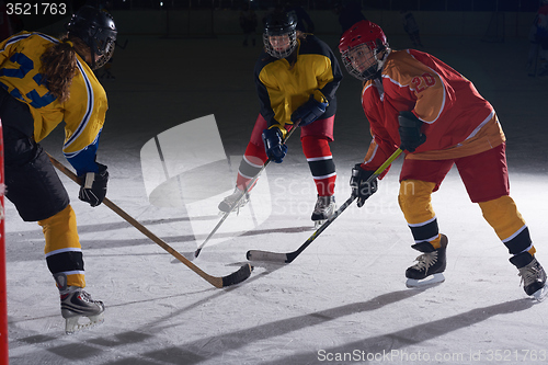 Image of teen ice hockey sport  players in action