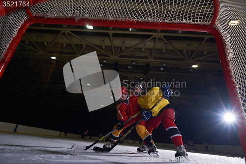 Image of teen ice hockey sport  players in action