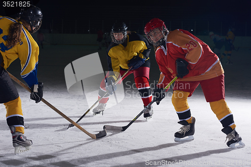 Image of teen ice hockey sport  players in action