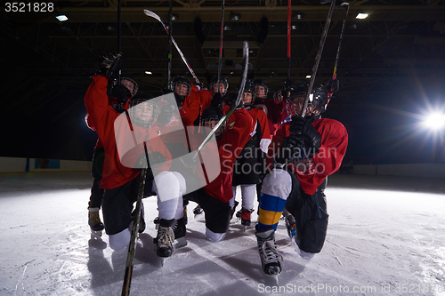 Image of happy children gropu  hockey team sport players