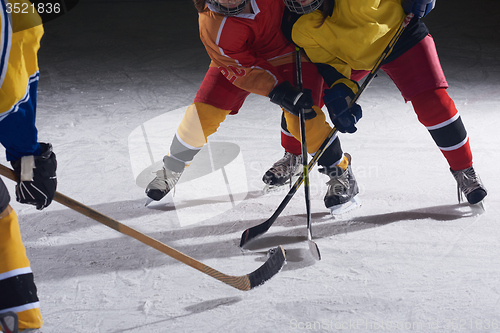 Image of teen ice hockey sport  players in action