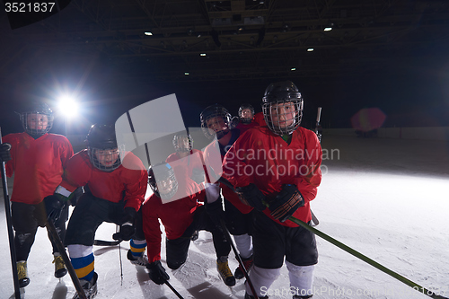 Image of happy children gropu  hockey team sport players