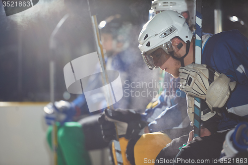 Image of ice hockey players on bench