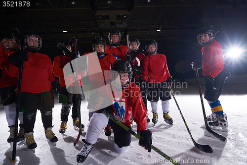 Image of happy children gropu  hockey team sport players