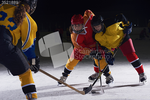 Image of teen ice hockey sport  players in action