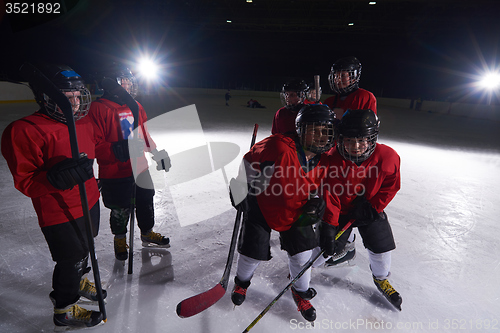 Image of happy children gropu  hockey team sport players