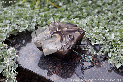 Image of Holy water shell at the grave