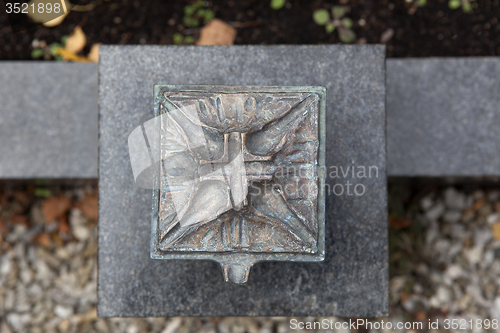 Image of Holy water shell at the grave