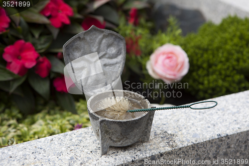 Image of Holy water shell at the grave