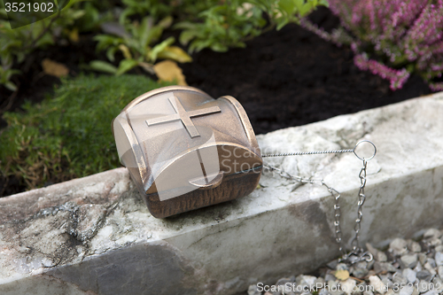 Image of Holy water shell at the grave