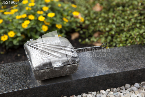 Image of Holy water shell at the grave