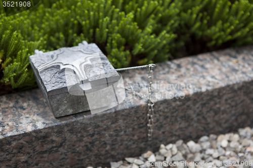 Image of Holy water shell at the grave