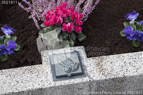 Image of Holy water shell at the grave