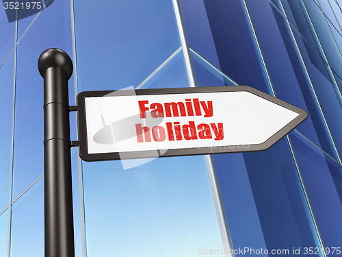 Image of Travel concept: sign Family Holiday on Building background