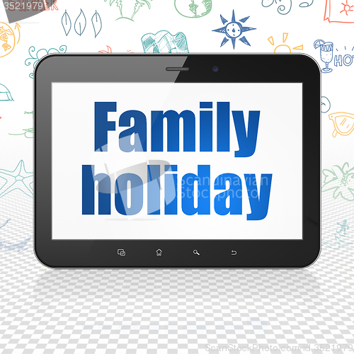 Image of Vacation concept: Tablet Computer with Family Holiday on display