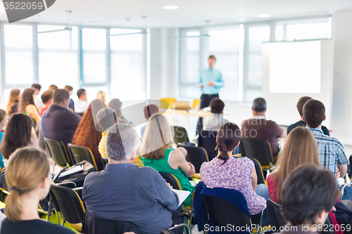 Image of Speaker Giving a Talk at Business Meeting.