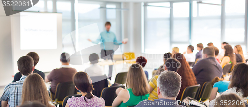 Image of Speaker Giving a Talk at Business Meeting.