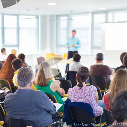 Image of Speaker Giving a Talk at Business Meeting.