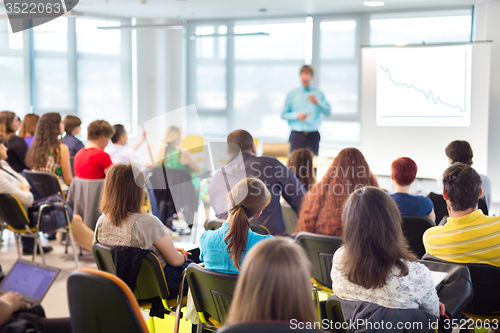 Image of Speaker Giving a Talk at Business Meeting.