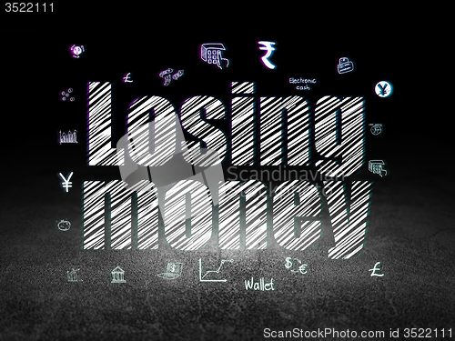 Image of Money concept: Losing Money in grunge dark room