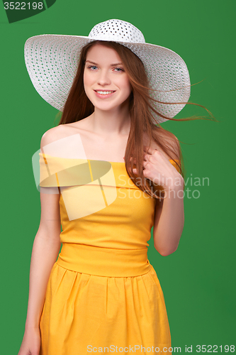 Image of Closeup portrait of woman in straw hat