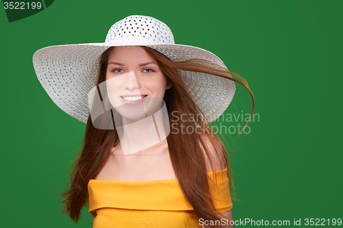 Image of Closeup portrait of woman in straw hat