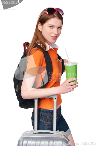 Image of Smiling girl with backpack and suitcase