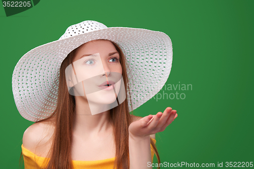 Image of Closeup portrait of woman in straw hat