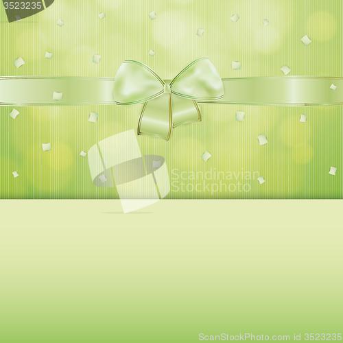 Image of green gift card with ribbon and confetti