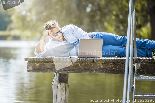 Image of man notebook outdoor