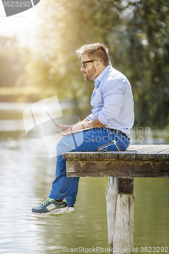 Image of man notebook outdoor