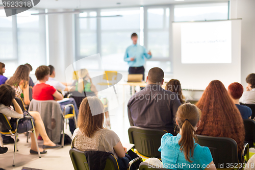 Image of Speaker Giving a Talk at Business Meeting.